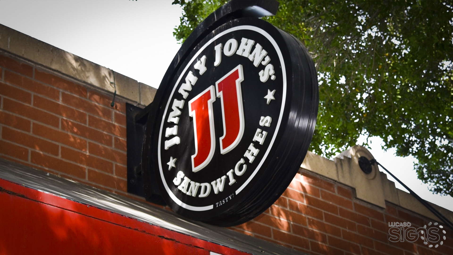 Round blade sign with illuminated channel letters and JJ logo for Jimmy John’s Sandwiches by Lucaso Signs