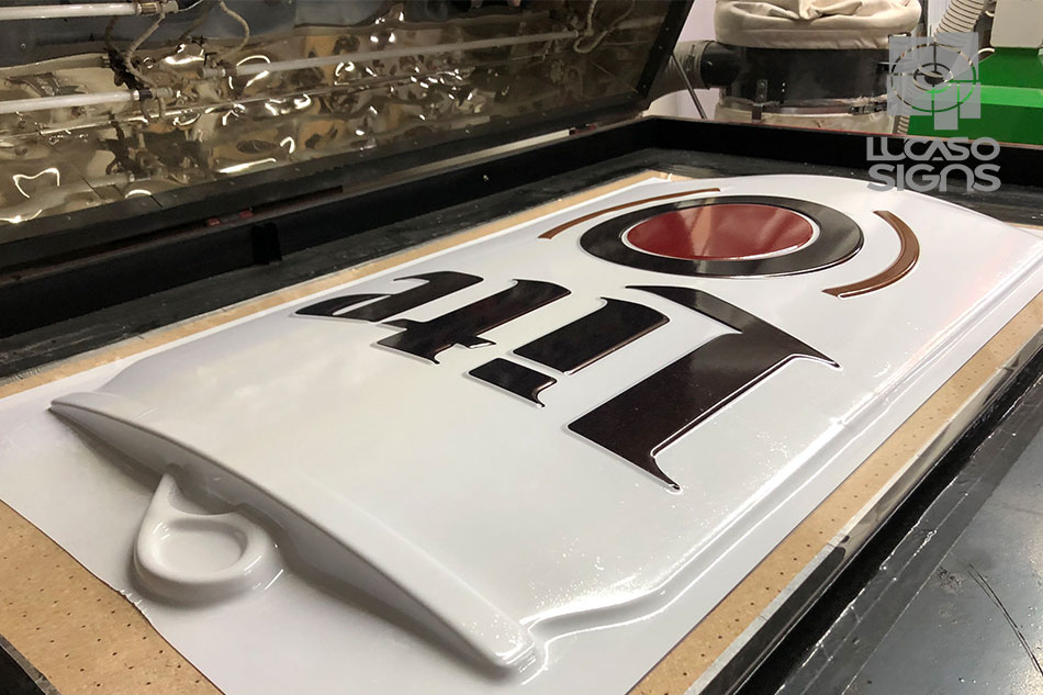 Thermoforming process creating a 3D Lite beer can sign with raised lettering and embossed details, custom fabrication by Lucaso Signs