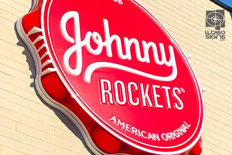 Red round thermoformed 3D sign with raised white lettering for Johnny Rockets, custom outdoor branding by Lucaso Signs