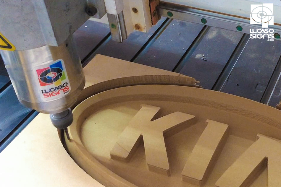 CNC router cutting mold for thermoformed KIA car logo emblem, precision sign manufacturing process by Lucaso Signs