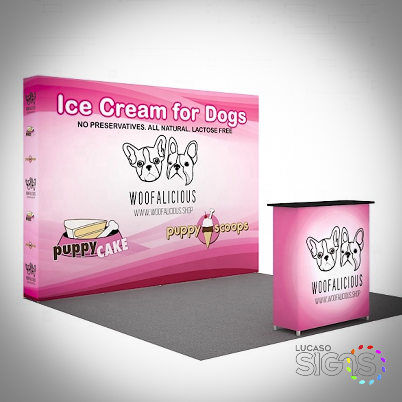 10x10 trade show booth with pink backdrop and counter promoting Woofalicious ice cream for dogs by Lucaso Signs
